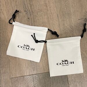 Coach Cream Drawstring Pouches